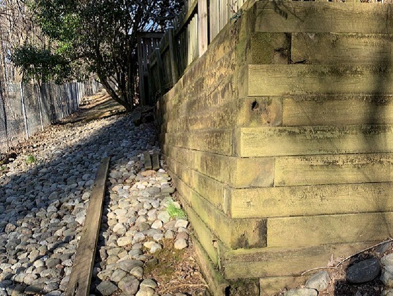 deteriorating timber retaining wall