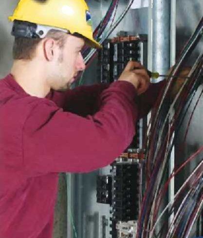 Man working on electrical system