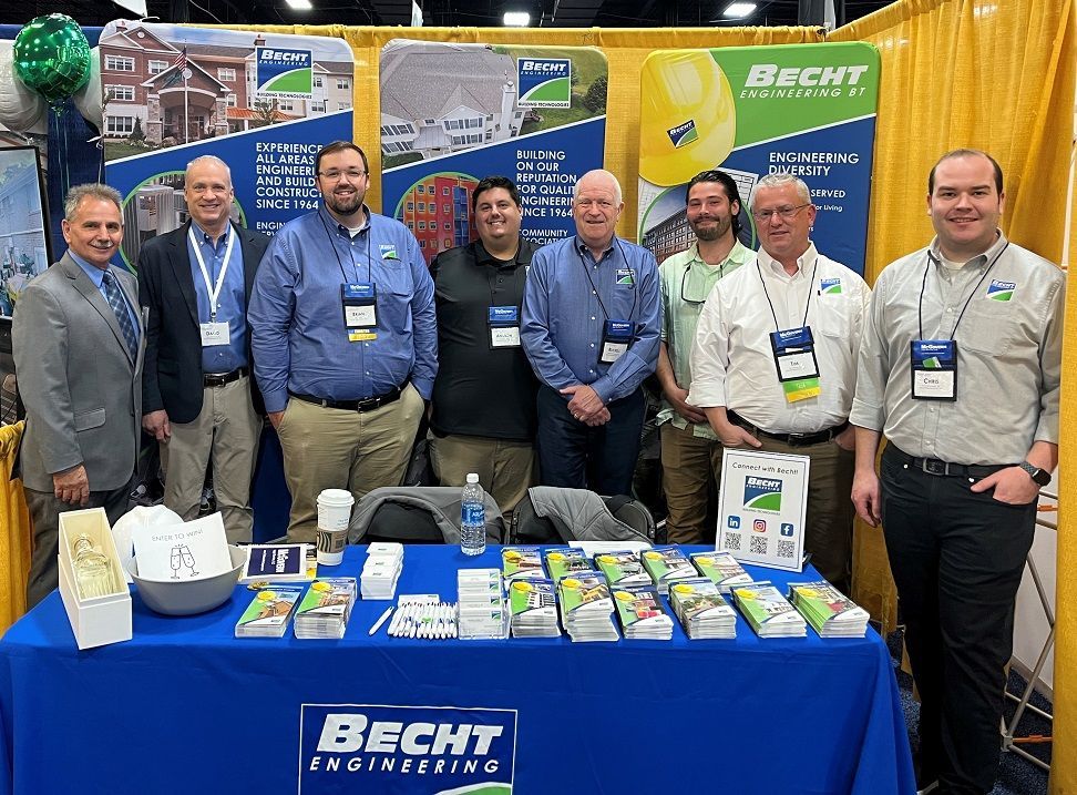 Becht staff at CAI event table