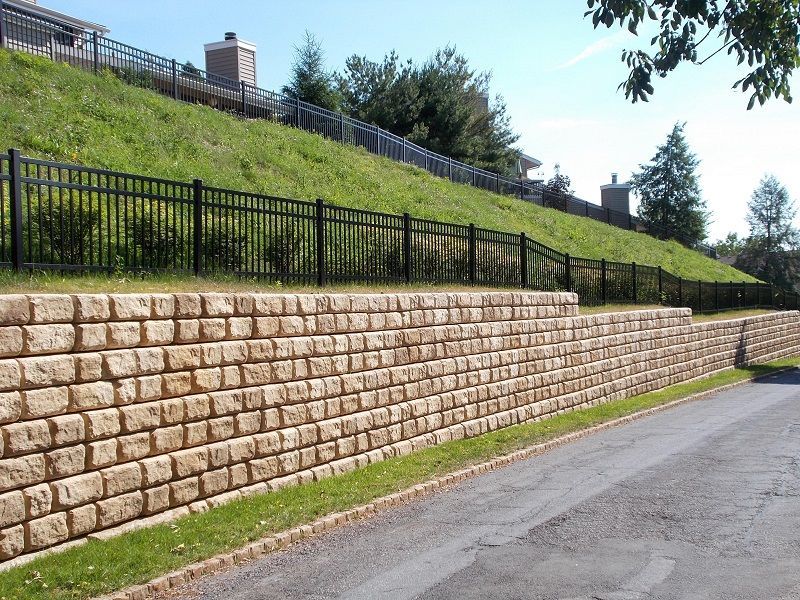 Retaining wall along a hill and roadway