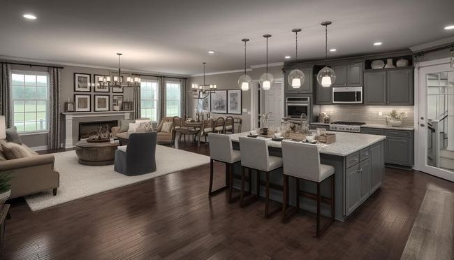Open-concept kitchen and living area with a large island, dining table, fireplace, and large windows.