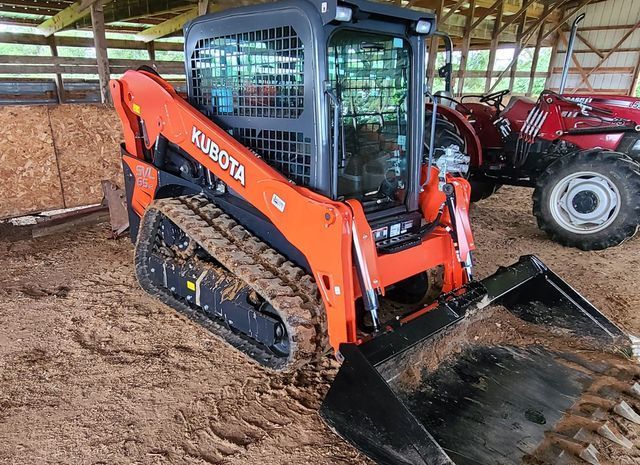 Small excavator parked inside a barn - Campbellsburg, IN | Twisted Electric LLC 