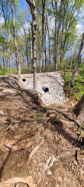 Two black pipes in the middle of a forest - Campbellsburg, IN | Twisted Electric LLC 
