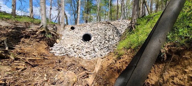 Large pipe with multiple rocks surrounding it - Campbellsburg, IN | Twisted Electric LLC 
