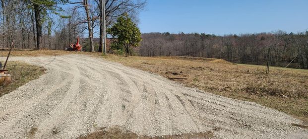Gravel road with tracks and a hill on the background - Campbellsburg, IN | Twisted Electric LLC 