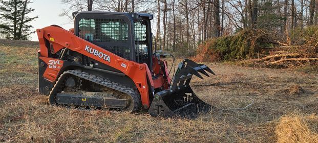 Orange excavator with the bucket pointing at the ground - Campbellsburg, IN | Twisted Electric LLC 