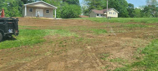 Wide dirt road with few house on the background - Campbellsburg, IN | Twisted Electric LLC 