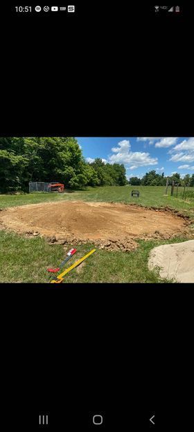 Large pile of dirt with red and yellow equipment - Campbellsburg, IN | Twisted Electric LLC 