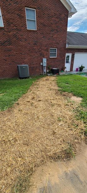 Brick house with a walkway made of hay in front of it - Campbellsburg, IN | Twisted Electric LLC 