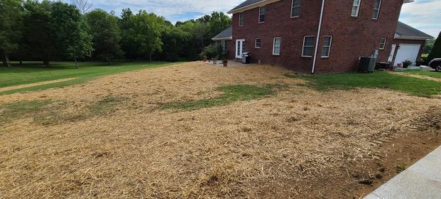 Large brick house with a lot of hay in front of it - Campbellsburg, IN | Twisted Electric LLC 