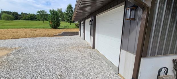 Garage with two garage doors and a gravel driveway - Campbellsburg, IN | Twisted Electric LLC 