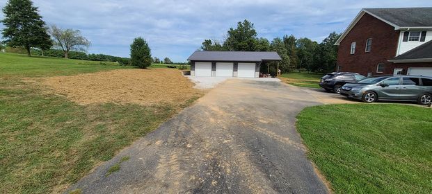 Driveway leading to a house with cars parked in front of it - Campbellsburg, IN | Twisted Electric LLC 