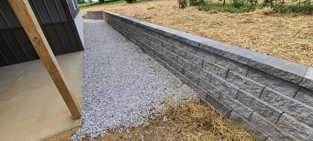 Brick wall being built next to a gravel path - Campbellsburg, IN | Twisted Electric LLC 