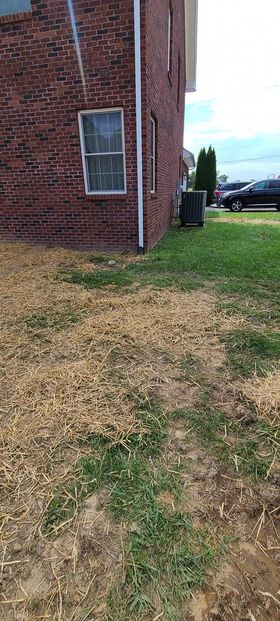 Brick house with a lot of hay in front of it - Campbellsburg, IN | Twisted Electric LLC 