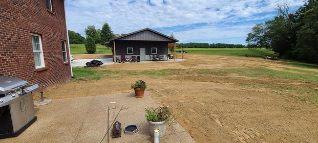 Patio with a grill and a house in the background - Campbellsburg, IN | Twisted Electric LLC 