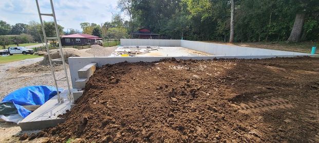 Large pile of dirt sitting in front of a house under construction - Campbellsburg, IN | Twisted Electric LLC 