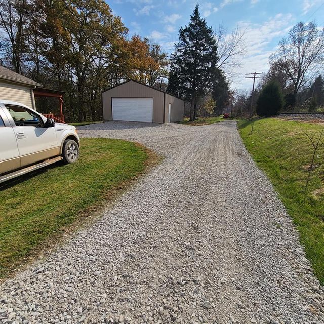 White and brown truck parked on the side of a gravel road next to a garage - Campbellsburg, IN | Twisted Electric LLC 
