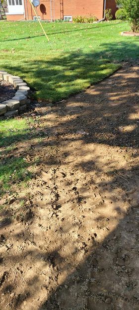 Dirt path going through a lush green lawn next to a house - Campbellsburg, IN | Twisted Electric LLC 