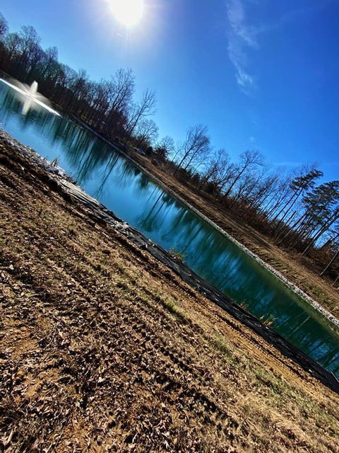 Pond with a fountain in the middle of it and diagonal shot - Campbellsburg, IN | Twisted Electric LLC 