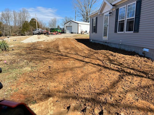 House beside dirt with green and white truck behind - Campbellsburg, IN | Twisted Electric LLC 