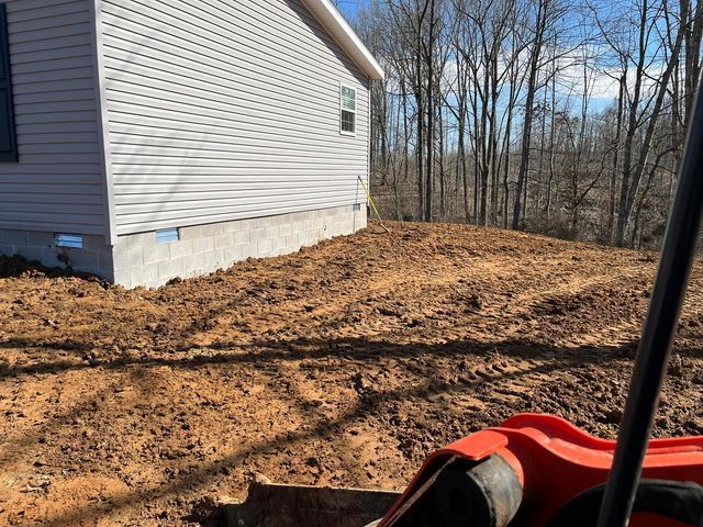 Large pile of dirt with excavator arm - Campbellsburg, IN | Twisted Electric LLC 