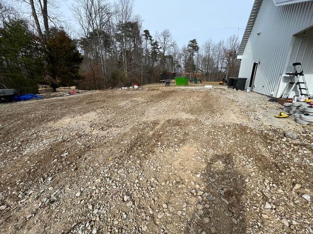 Gravel driveway leads to a house with a playground in the background - Campbellsburg, IN | Twisted Electric LLC 