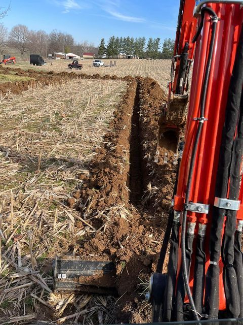 Red excavator hydraulic stick cylinder - Campbellsburg, IN | Twisted Electric LLC 