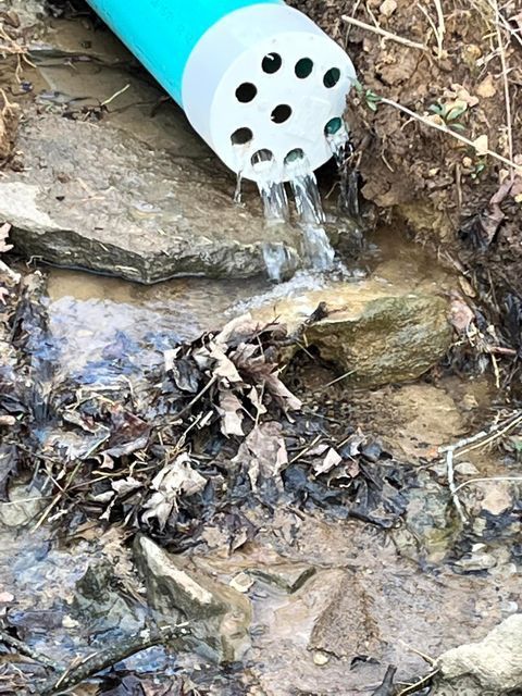 Water coming out of a pipe in the dirt - Campbellsburg, IN | Twisted Electric LLC 
