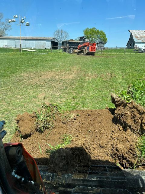 Newly plowed dirt using excavator on grassy field - Campbellsburg, IN | Twisted Electric LLC 