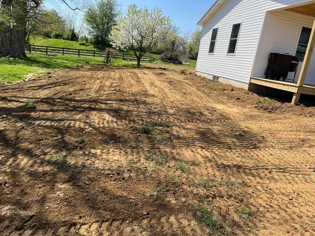 White wooden house with two window sitting on dirt - Campbellsburg, IN | Twisted Electric LLC 