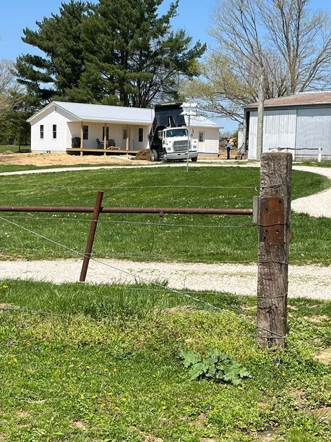 White dump truck parked in front of a house with barbed wire fence - Campbellsburg, IN | Twisted Electric LLC 