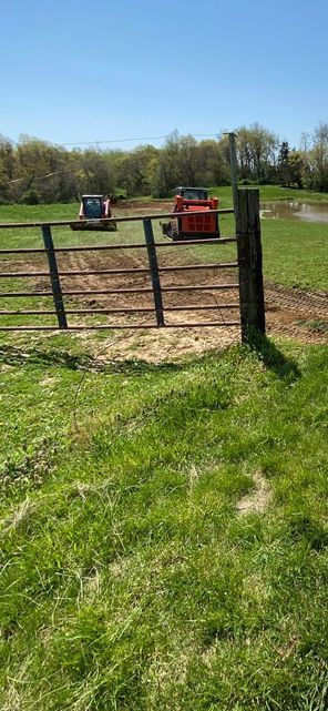 Tractor plowing a field next to a fence - Campbellsburg, IN | Twisted Electric LLC 