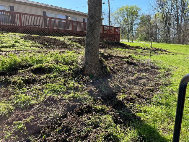 Large pile of dirt is sitting in front of a house and single tree - Campbellsburg, IN | Twisted Electric LLC 