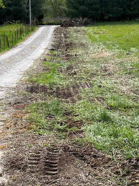 Dirt road going through a dirty grassy field - Campbellsburg, IN | Twisted Electric LLC 