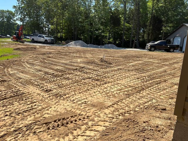 Large dirt field with a truck parked on the left part - Campbellsburg, IN | Twisted Electric LLC 