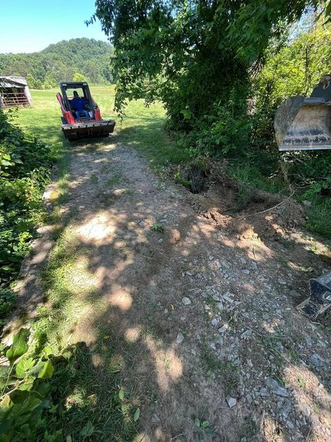 Worker driving a small bulldozer - Campbellsburg, IN | Twisted Electric LLC 