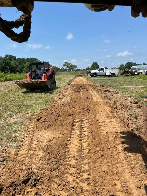 Front view of bulldozer driving down a dirt road - Campbellsburg, IN | Twisted Electric LLC 