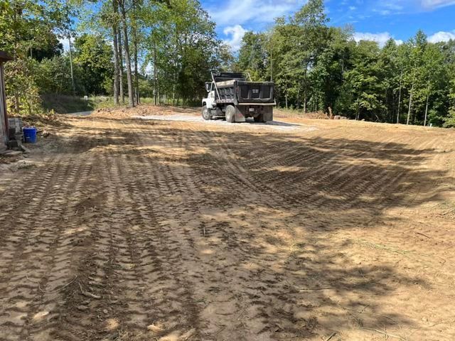 Large dump truck parked in the middle of a dirt field - Campbellsburg, IN | Twisted Electric LLC 