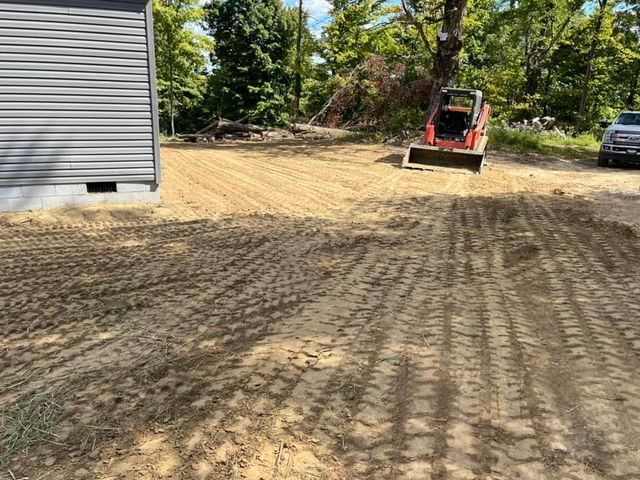 Bulldozer moving dirt in a yard next to grey wooden house - Campbellsburg, IN | Twisted Electric LLC 