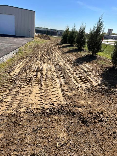 Dirt road with wheel tracks and trees beside house - Campbellsburg, IN | Twisted Electric LLC 