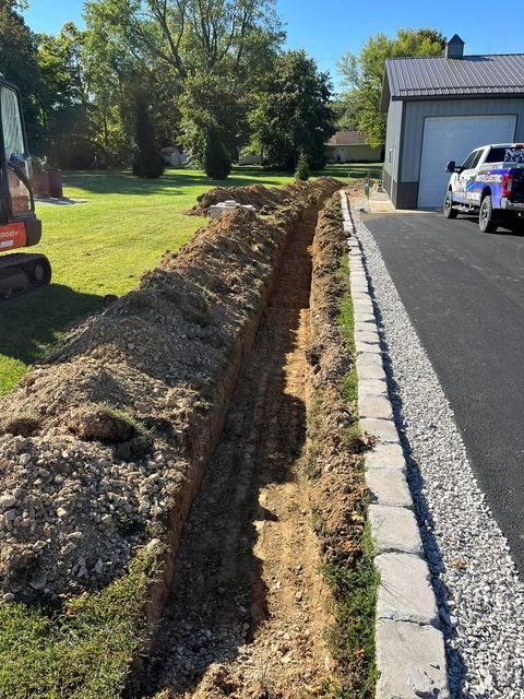 Truck parked on the side of the road next to a large pile of dirt - Campbellsburg, IN | Twisted Electric LLC 