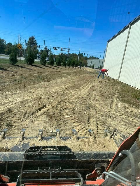 Man inside bulldozer working on a dirt road - Campbellsburg, IN | Twisted Electric LLC 