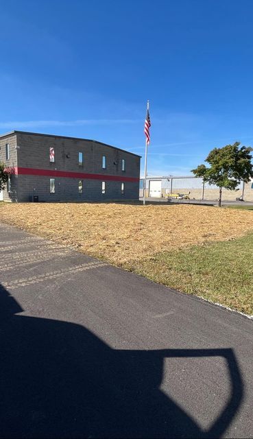 Large building with a flag pole in front of it - Campbellsburg, IN | Twisted Electric LLC 