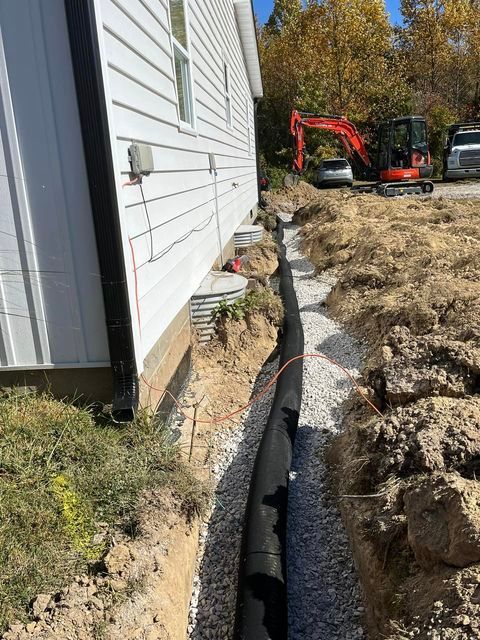 Drainage system installation on the side of a house - Campbellsburg, IN | Twisted Electric LLC 