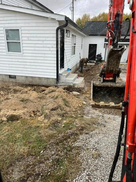Excavator beside house and dirt - Campbellsburg, IN | Twisted Electric LLC 