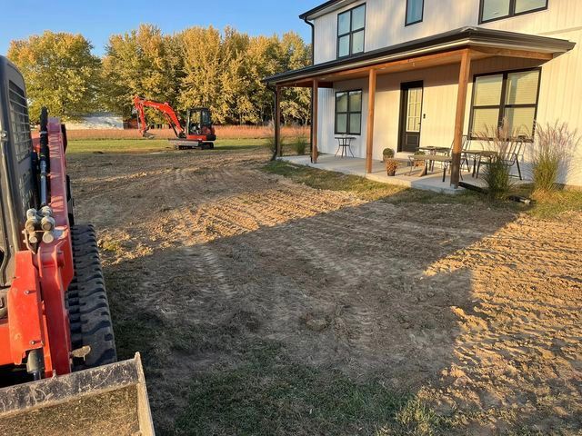Red excavator is parked in front of a  isolated house - Campbellsburg, IN | Twisted Electric LLC 