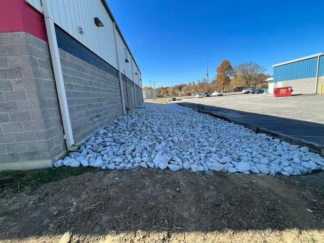 Pile of rocks sitting in front of a brick building - Campbellsburg, IN | Twisted Electric LLC 