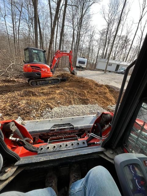 Worker sitting in the driver's seat of a bulldozer - Campbellsburg, IN | Twisted Electric LLC 