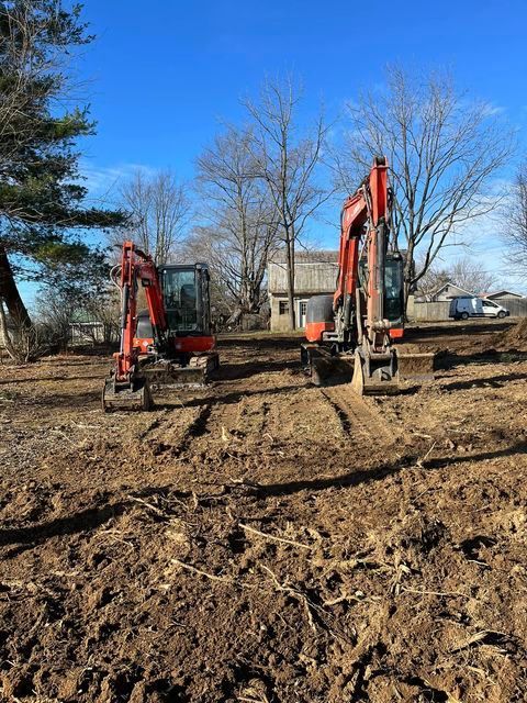 Two excavators sitting on top of a dirt field working together - Campbellsburg, IN | Twisted Electric LLC 