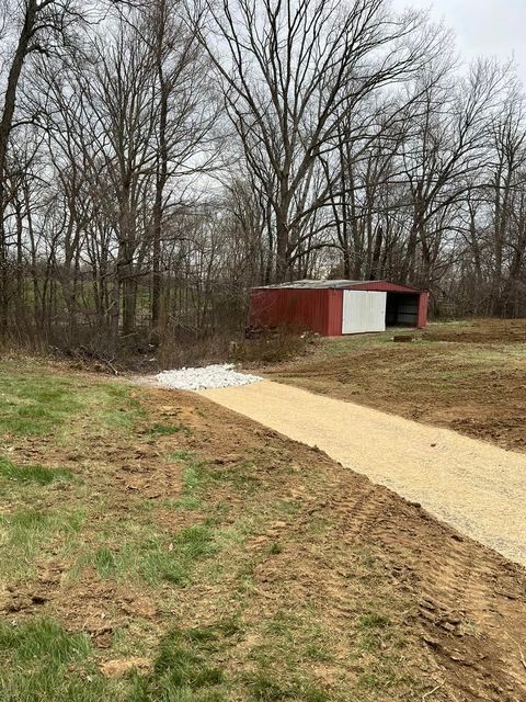 Dirt road leading to a red barn in the middle of a field - Campbellsburg, IN | Twisted Electric LLC 